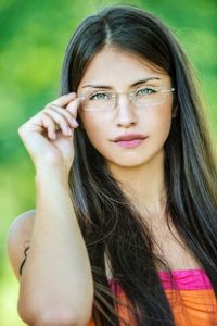 Young woman with eyeglasses considering LASIK Surgery