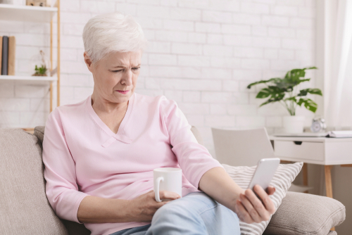 Older woman reading about Cataracts