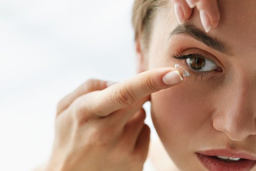 Woman using contact lenses