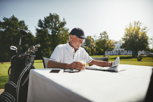 Older man reading about cataracts