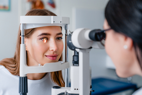 ophthalmologist performing eye exam