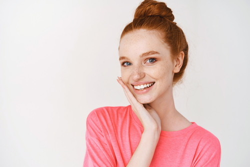 woman posing with one hand on her face