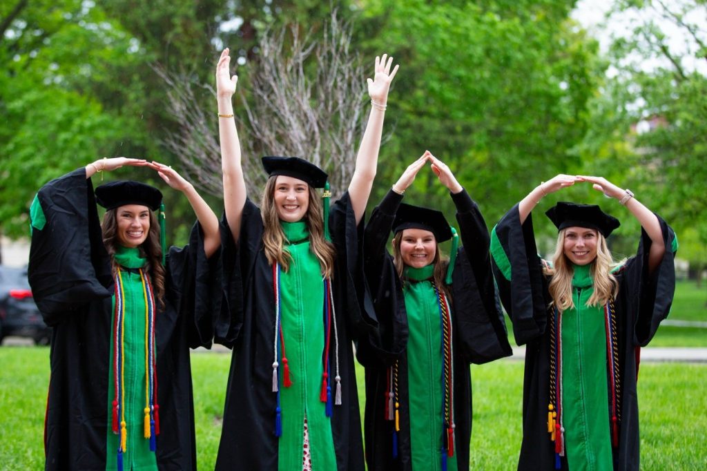 How firm thy friendship. Dr. Maxwell and her friends supporting the Buckeyes at their graduation.